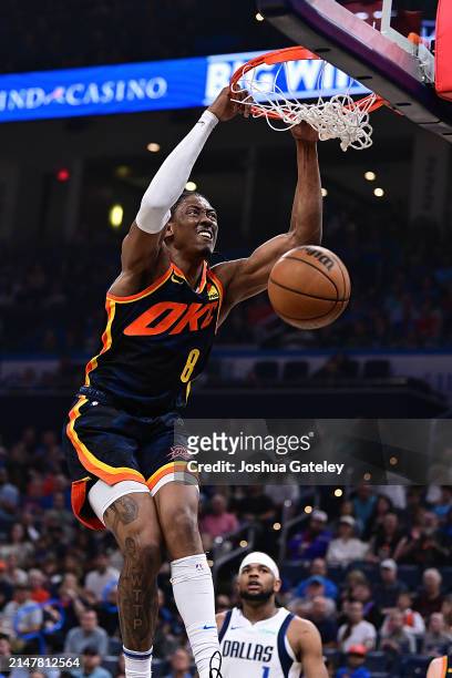 Jalen Williams of the Oklahoma City Thunder goes up for a dunk during the first half against the Dallas Mavericks at Paycom Center on April 14, 2024...