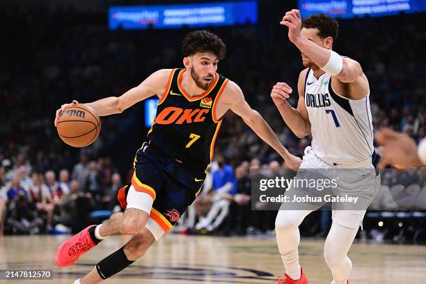 Chet Holmgren of the Oklahoma City Thunder handles the ball during the first half against the Dallas Mavericks at Paycom Center on April 14, 2024 in...