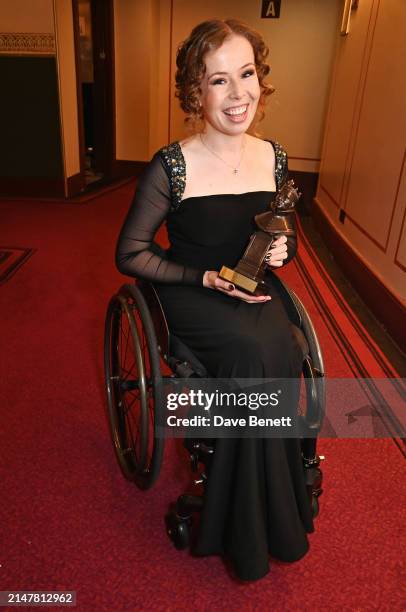 Amy Trigg, winner of Best Actress in a Supporting Role in a Musical for "The Little Big Things", poses backstage during The Olivier Awards 2024 at...