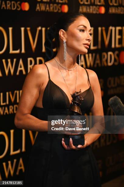 Nicole Scherzinger, winner of the Best Actress In A Musical award for "Sunset Boulevard", poses backstage during The Olivier Awards 2024 at Royal...