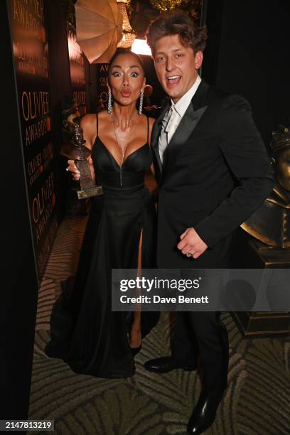 Nicole Scherzinger and Tom Francis, winners of Best Actress and Best Actor in a Musical for "Sunset Boulevard", pose backstage during The Olivier...