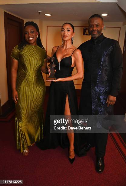 Georgina Onuorah, Nicole Scherzinger, winner of the Best Actress In A Musical award for "Sunset Boulevard", and Adrian Lester pose backstage during...