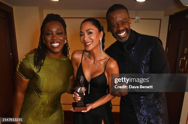 Georgina Onuorah, Nicole Scherzinger, winner of the Best Actress In A Musical award for "Sunset Boulevard", and Adrian Lester pose backstage during...