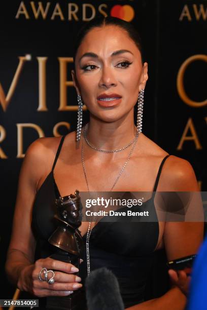 Nicole Scherzinger, winner of the Best Actress In A Musical award for "Sunset Boulevard", poses backstage during The Olivier Awards 2024 at Royal...
