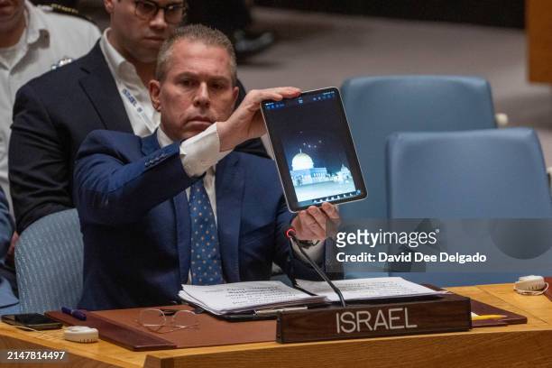 Israel's Ambassador to the United Nations Gilad Erdan shows a video of bombs being intercepted over the Al-Aqsa Mosque during the United Nations...