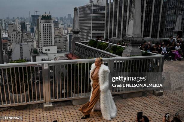 Model displays a creation by Joao Pimenta during the Sao Paulo Fashion Week at the Martinelli building in Sao Paulo, Brazil on April 14, 2024.