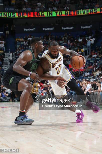LeBron James of the Los Angeles Lakers handles the ball during the game against the New Orleans Pelicans on April 14, 2024 at the Smoothie King...