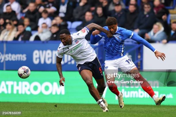 Ricardo Santos of Bolton Wanderers and Kusini Yengi of Portsmouth compete during the Sky Bet League One match between Bolton Wanderers and Portsmouth...