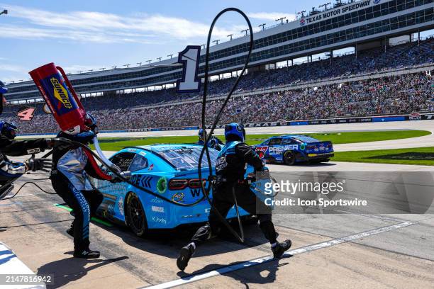 Ross Chastain gets four fresh tires and fuel during the NASCAR Cup Series AutoTrader EchoPark Automotive 400 on April 14, 2024 at Texas Motor...