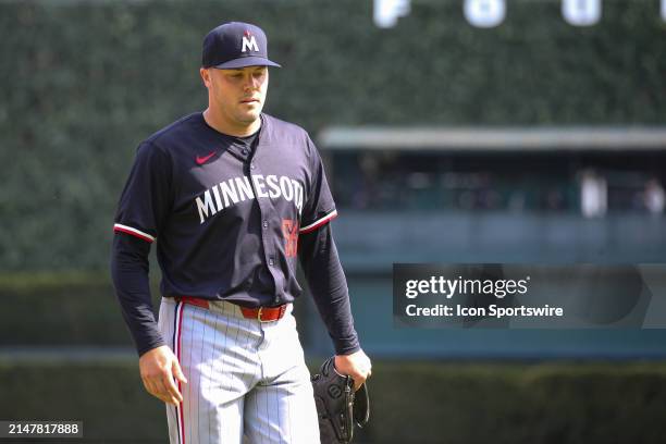 Minnesota Twins pitcher Caleb Thielbar walks to the dugout after being relieved during the eighth inning of a regular season Major League Baseball...