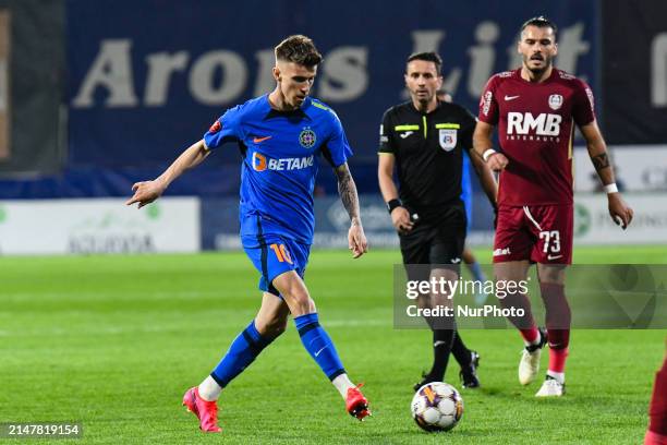 Octavian Popescu is in action during the Romania Superliga Play Off between CFR 1907 Cluj and FCSB at Dr. Constantin Radulescu Stadium in...