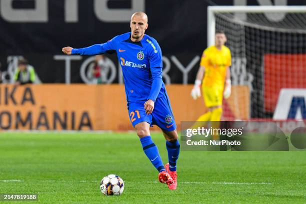 Vlad Chiriches is in action during the Romania Superliga Play Off between CFR 1907 Cluj and FCSB at Dr. Constantin Radulescu Stadium in Cluj-Napoca,...