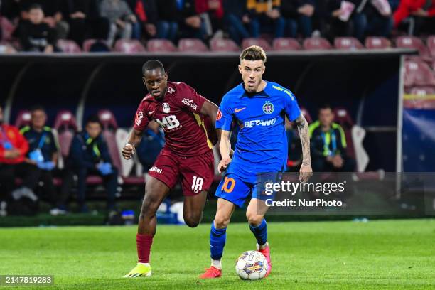 Octavian Popescu and Kader Keita are in action during the Romania Superliga Play Off between CFR 1907 Cluj and FCSB at Dr. Constantin Radulescu...