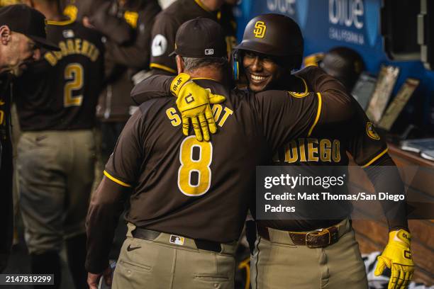 Jurickson Profar of the San Diego Padres hugs Manager Mike Shildt San Diego Padres a the end of the seventh inning against the Los Angeles Dodgers at...