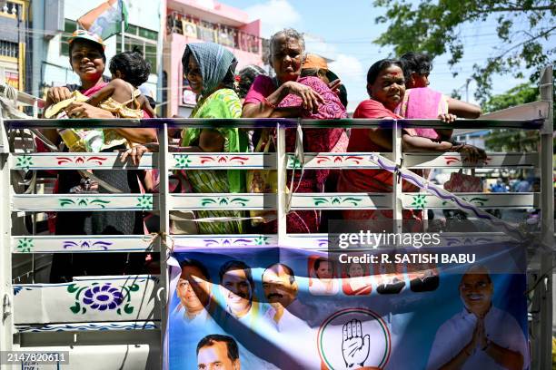 Supporters of India's opposition party, Indian National Congress await the arrival of their party President Mallikarjun Kharge, prior to his public...