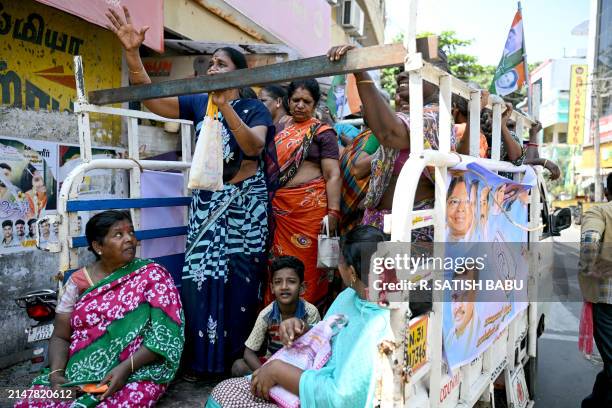 Supporters of India's opposition party, Indian National Congress await the arrival of their party President Mallikarjun Kharge, prior to his public...