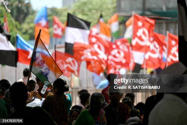 Supporters of India's opposition parties, Indian National Congress and Communist Party of India CPI await the arrival of INC party President...