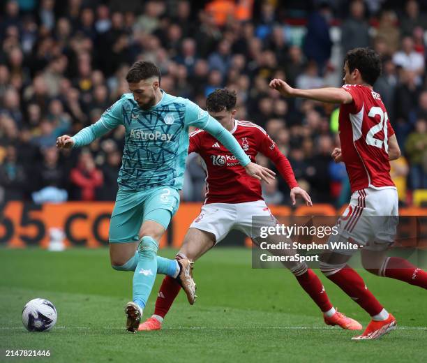 Wolverhampton Wanderers' Matt Doherty shields the ball from Nottingham Forest's Neco Williams and Giovanni Reyna during the Premier League match...