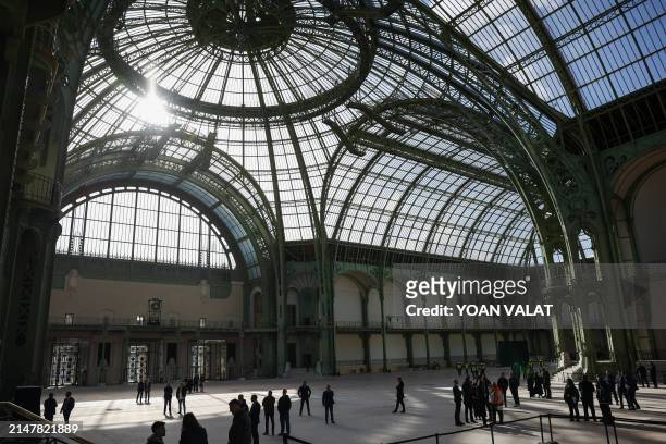 This photograph shows a view of the glass dome in the nave of Le Grand Palais during a presidential visit, in Paris, on April 15 100 days ahead of...