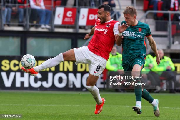 Vangelis Pavlidis of AZ Alkmaar and Dario Van Den Buijs of RKC Waalwijk battle for possession during the Dutch Eredivisie match between AZ Alkmaar...