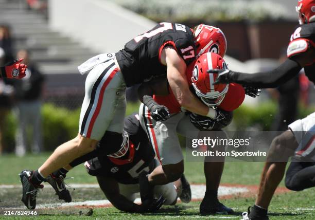 Athens, GA Georgia Bulldogs Defensive Back Dan Jackson tackles Georgia Bulldogs Running Back Trevor Etienne during the G-Day Red and Black Spring...