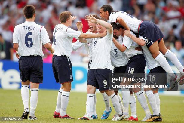 June 25: Steven Gerrard, David Beckham, Wayne Rooney, Ashley Cole, Michael Carrick and Rio Ferdinand of England celebrate during the FIFA World Cup...