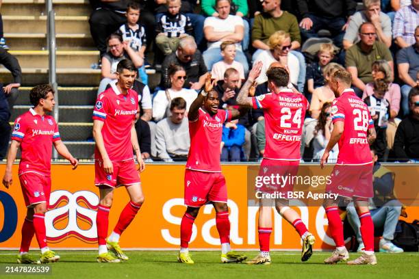 Che Nunnely of sc Heerenveen celebrates with Patrik Walemark of sc Heerenveen after scoring his team's first goal during the Dutch Eredivisie match...