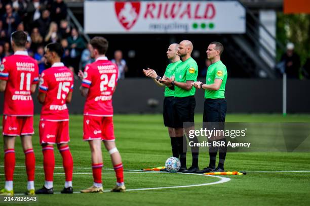 Assistant Referee Nils van Kampen, Referee Rob Dieperink and Assistant Referee Yorick Weterings applaud during the Dutch Eredivisie match between...