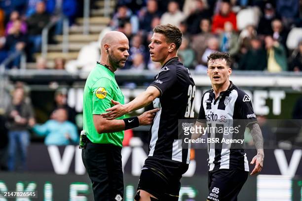 Referee Rob Dieperink talks with Sem Scheperman of Heracles Almelo during the Dutch Eredivisie match between Heracles Almelo and sc Heerenveen at the...