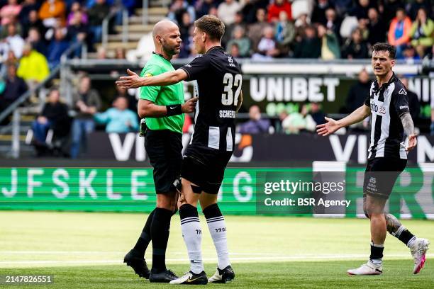 Referee Rob Dieperink talks with Sem Scheperman of Heracles Almelo during the Dutch Eredivisie match between Heracles Almelo and sc Heerenveen at the...