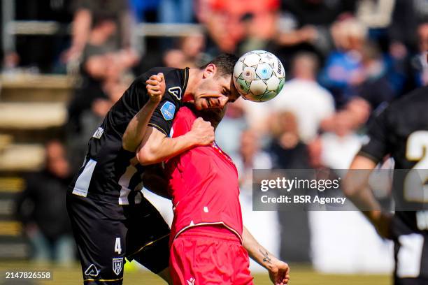 Sven Sonnenberg of Heracles Almelo and Pelle van Amersfoort of sc Heerenveen compete for the headed ball during the Dutch Eredivisie match between...