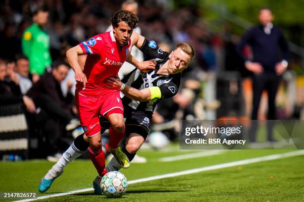 Mats Kohlert of sc Heerenveen is challenged by Brian De Keersmaecker of Heracles Almelo during the Dutch Eredivisie match between Heracles Almelo and...