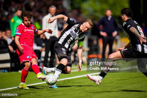 Mats Kohlert of sc Heerenveen is challenged by Brian De Keersmaecker of Heracles Almelo during the Dutch Eredivisie match between Heracles Almelo and...