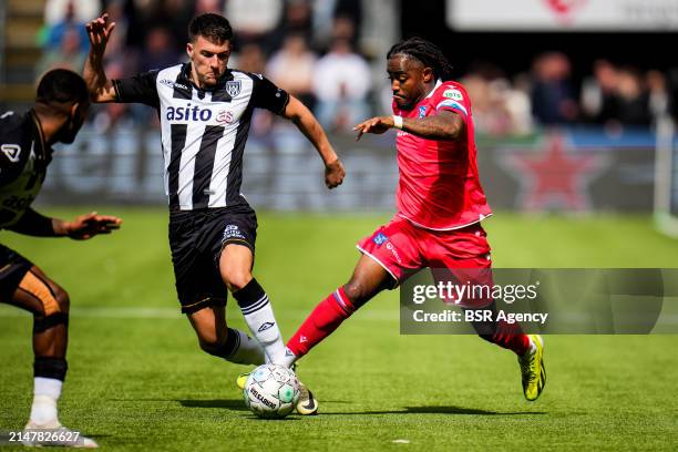 Ajdin Hrustic of Heracles Almelo and Che Nunnely of sc Heerenveen battle for possession during the Dutch Eredivisie match between Heracles Almelo and...