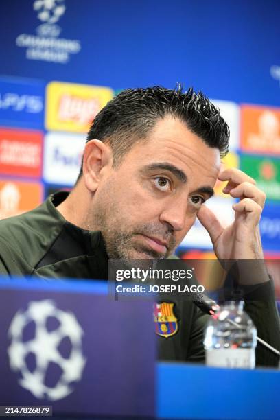 Barcelona's Spanish coach Xavi gives a press conference on the eve of their UEFA Champions League quarter-final second leg football match against...