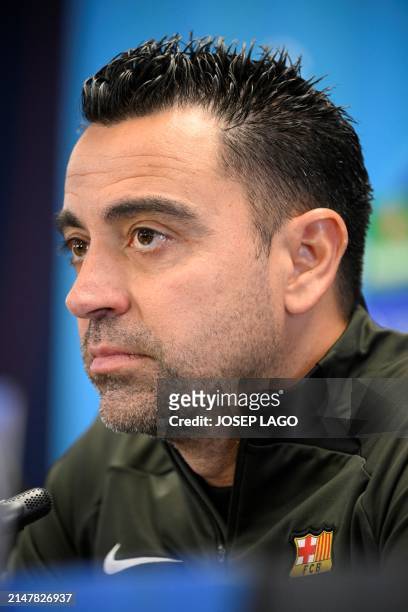 Barcelona's Spanish coach Xavi gives a press conference on the eve of their UEFA Champions League quarter-final second leg football match against...