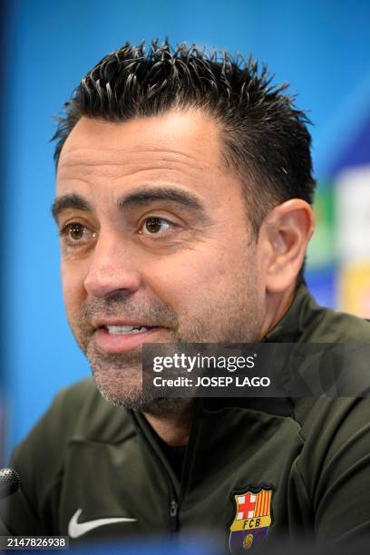 Barcelona's Spanish coach Xavi gives a press conference on the eve of their UEFA Champions League quarter-final second leg football match against...