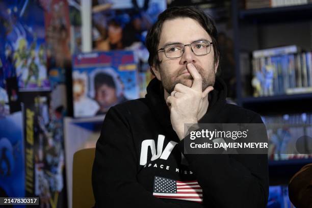 French youtuber and videographer Frederic Molas , who co-founded "Le joueur du grenier" youtube channel gestures during an interview in his studio in...