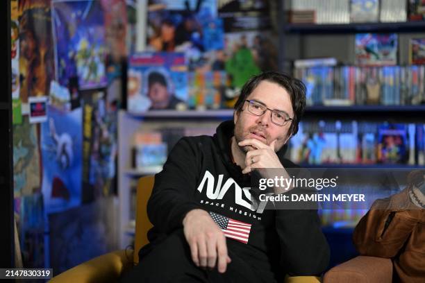 French youtuber and videographer Frederic Molas , who co-founded "Le joueur du grenier" youtube channel gestures during an interview in his studio in...