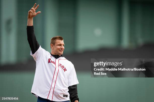 Ceremonial first pitch is thrown by Rob Gronkowski, former New England Patriots tight end and Grand Marshall for the 2024 Boston Marathon, during...