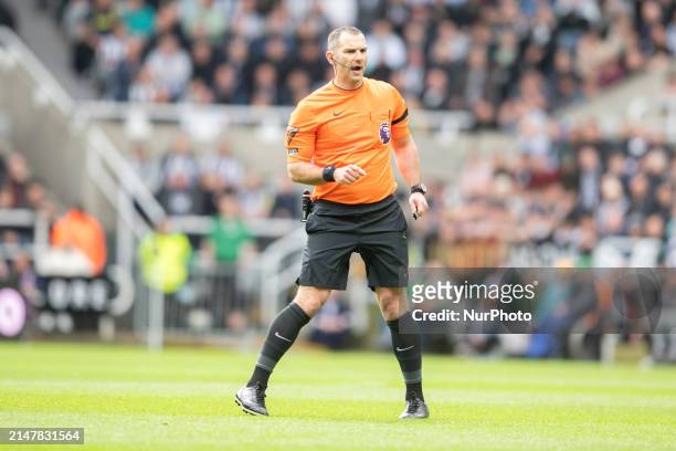 Referee Tim Robinson is officiating the Premier League match between Newcastle United and Tottenham Hotspur at St. James's Park in Newcastle, on...