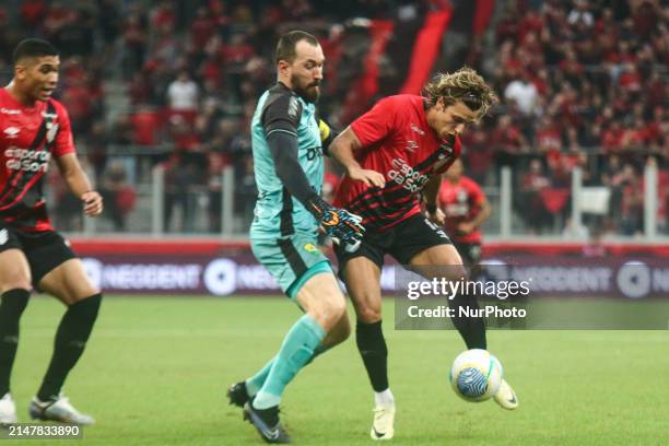 Player Cannobio of Athletico PR is disputing the ball against player Walter of Cuiaba during the match between Athletico PR and Cuiaba for the...