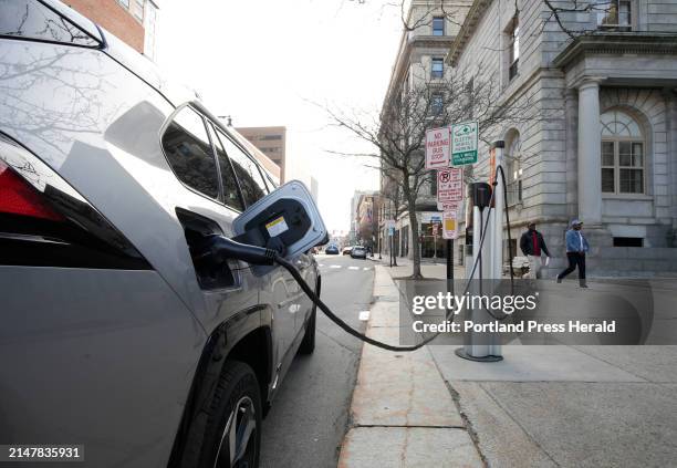 Toyota Rav4 plugin hybrid charges at a ChargePoint charger in front of City Hall in Portland on Wednesday. The state Board of Environmental...