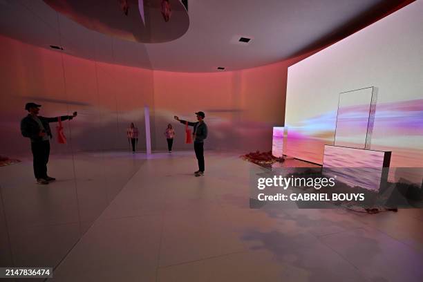 People visit the immersive design installation "Newfound Equilibrium" presented by Samsung, as part of the Fuorisalone 2024 event, on the eve of the...