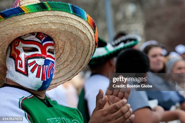 Newton, MA Ricardo Fernandez wore a Mexican wresting mask on Heartbreak Hill during the Boston Marathon.