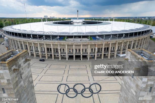 This aerial view taken on April 15, 2024 shows the Olympic rings symbol in front of the Olympic Stadium in Berlin, Germany. The UEFA EURO 2024...