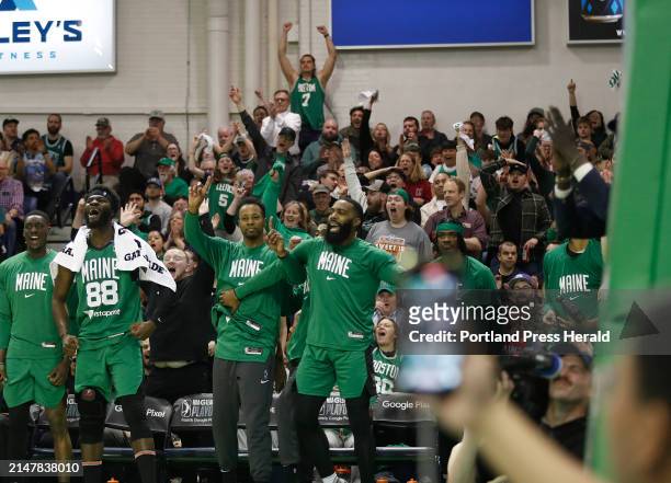 Maine Celtics teammates and fans react to a first quarter basket against Oklahoma City.