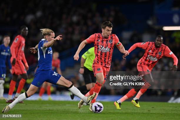 Everton's Irish defender Seamus Coleman is fouled by Chelsea's Ukrainian midfielder Mykhailo Mudryk during the English Premier League football match...