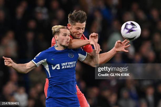 Chelsea's Ukrainian midfielder Mykhailo Mudryk vies with Everton's English defender James Tarkowski during the English Premier League football match...