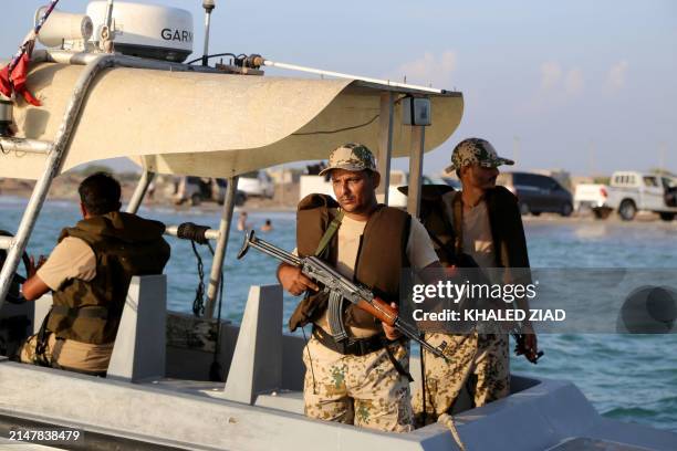 Yemeni coastguards loyal to the internationally-recognised government ride in a patrol boat in the Red Sea off the government-held town of Mokha in...